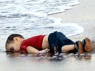refugee boy on a beach