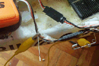 sticking pins and needles into wires to check connectors